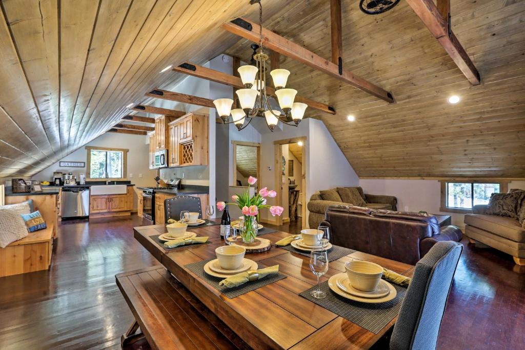 a dining room and living room with a wooden table at 5 Mi to Skiing! Family Getaway Near Donner Lake in Truckee