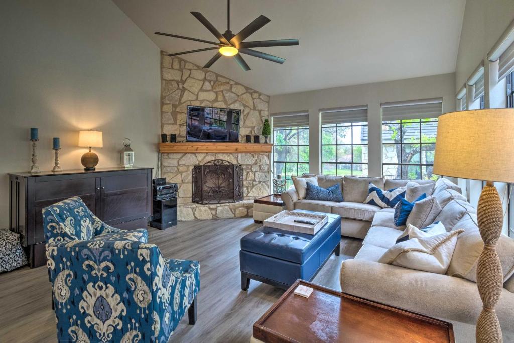 a living room with a couch and a fireplace at Horseshoe Bay Townhome with Patio and Outdoor Pool! in Horseshoe Bay
