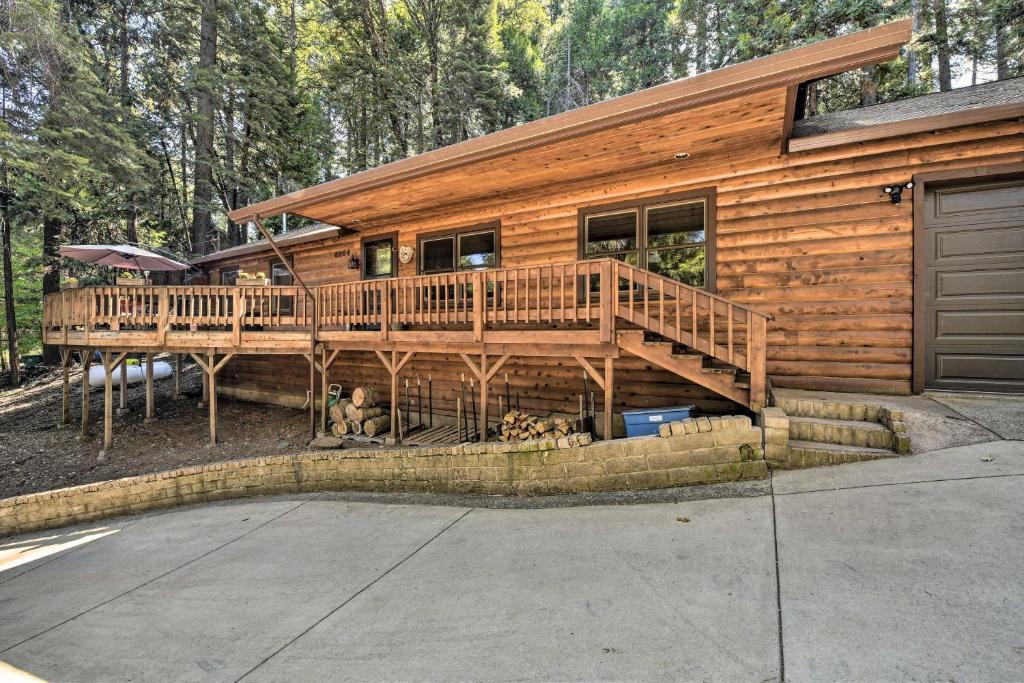 a large wooden house with a large deck at Pollock Pines Resort Cabin 11 Mi to Apple Hill in Pollock Pines