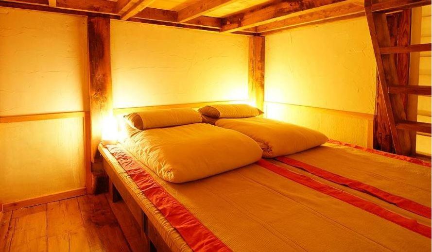 Postel nebo postele na pokoji v ubytování Hanok Story Guesthouse