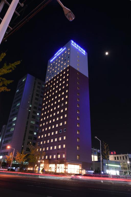a tall building with blue lights on it at night at Toyoko Inn Ulsan Samsan in Ulsan