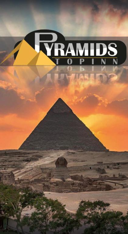 an image of the pyramids of giza at sunset at Pyramids Top Inn in Cairo