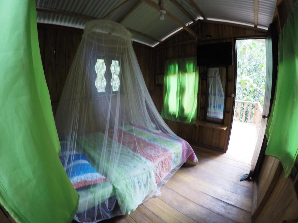 Postel nebo postele na pokoji v ubytování Posada Fin del Mundo