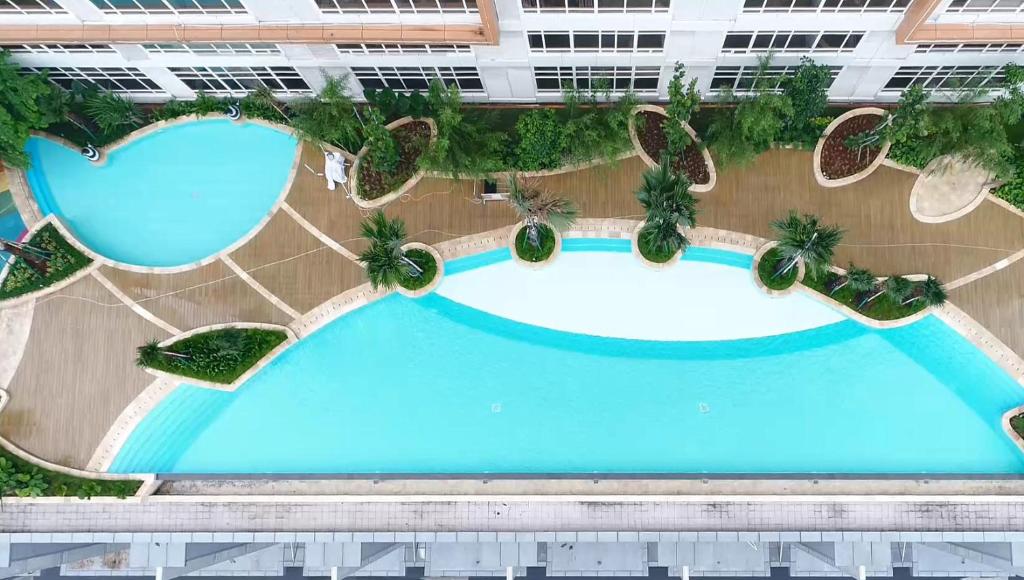 Bazén v ubytování Fika Rooms Tangerang By Skandinavia nebo v jeho okolí