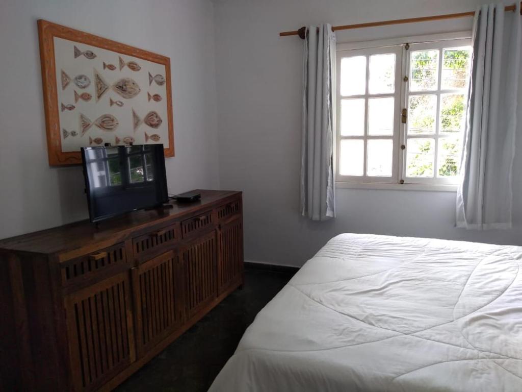  Casa ampla com ar condicionado e churrasqueira