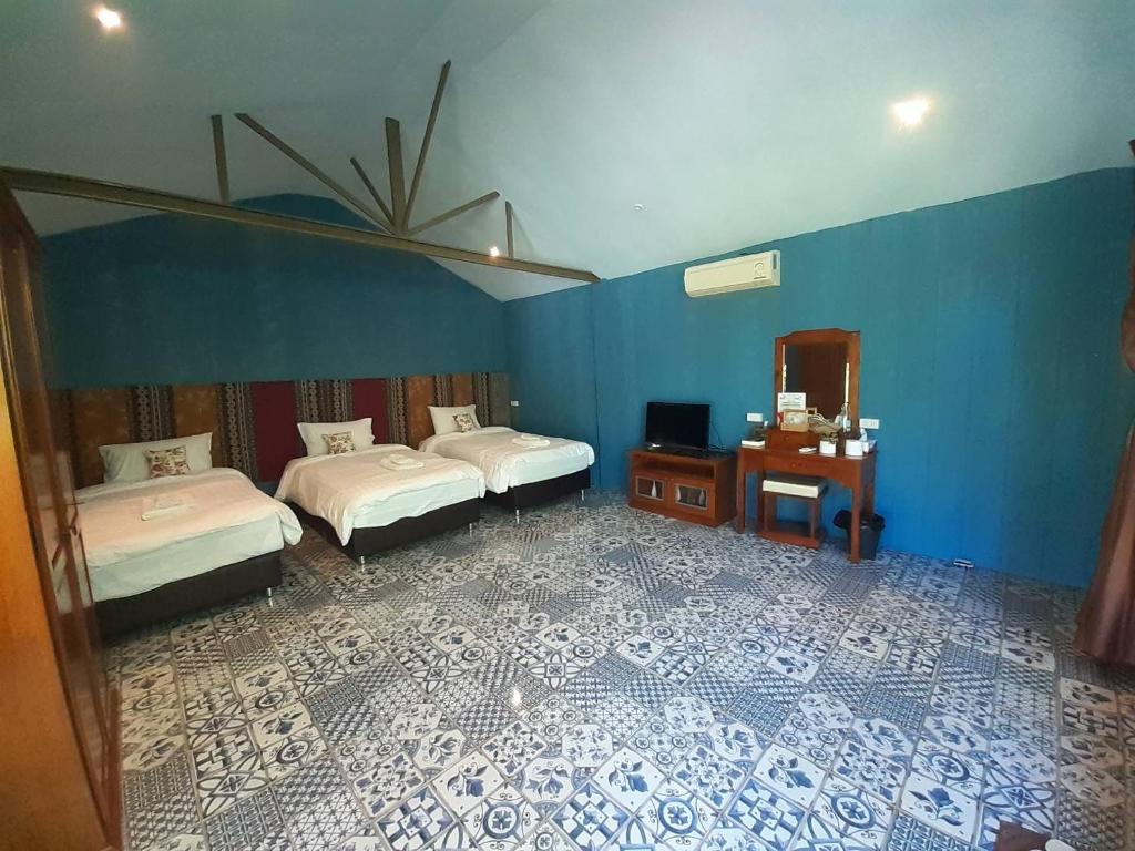 Postel nebo postele na pokoji v ubytování Thanburi resort