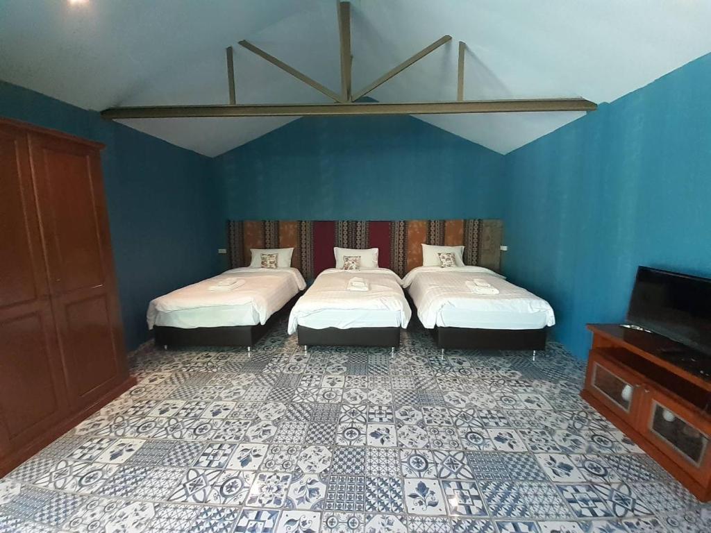 Postel nebo postele na pokoji v ubytování Thanburi resort