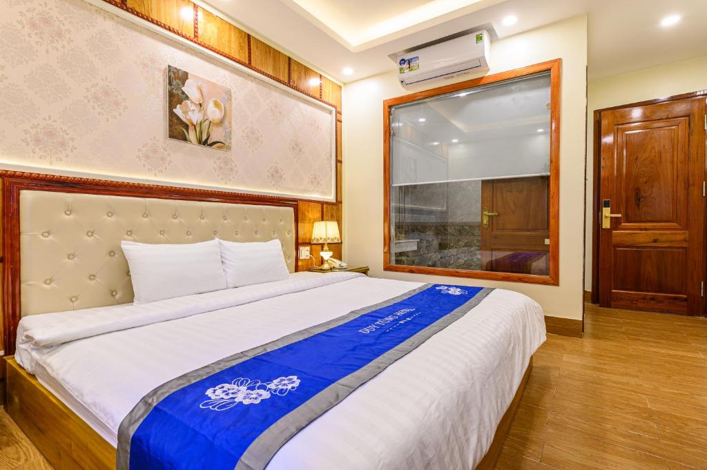 Giường trong phòng chung tại Duy Tung Hotel Da Nang