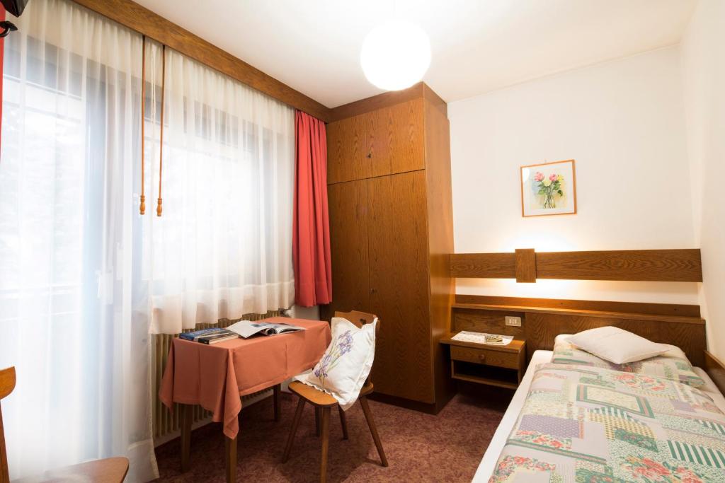 Postel nebo postele na pokoji v ubytování Ciasa Iris