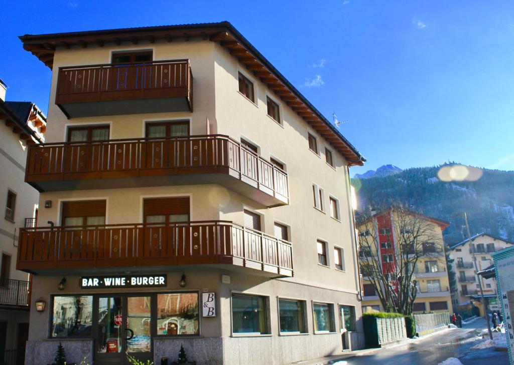 a large building with a balcony on top of it at B&B Penak Mountain wellness in Aprica