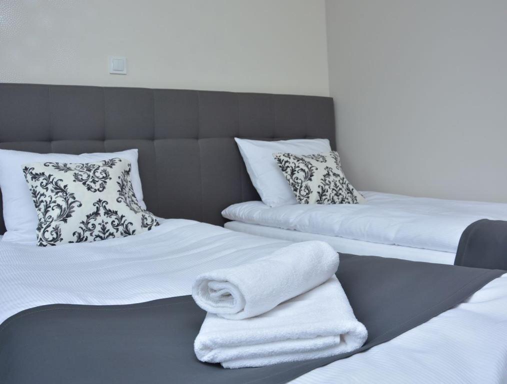 Posteľ alebo postele v izbe v ubytovaní Hotelik 51