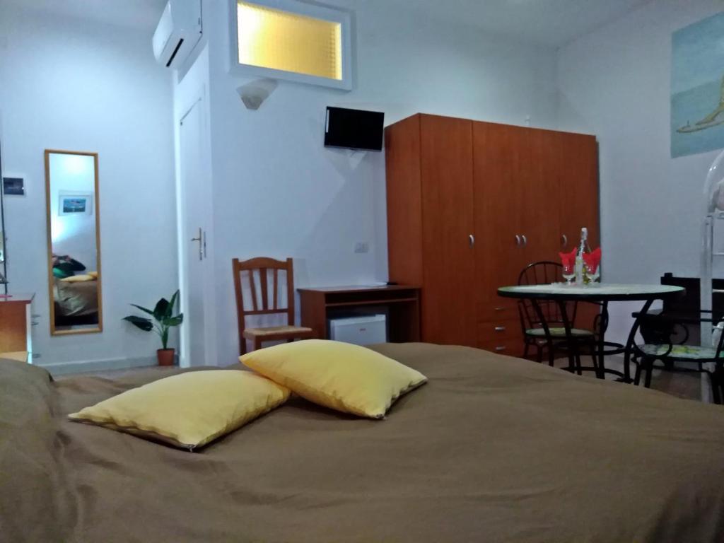 Posteľ alebo postele v izbe v ubytovaní B&B Vico Vacanze