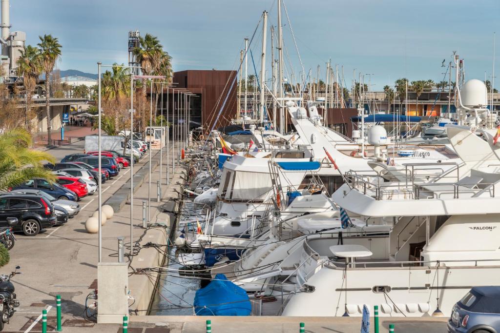 a bunch of boats parked in a marina at Boat Hotel Barcelona in Barcelona