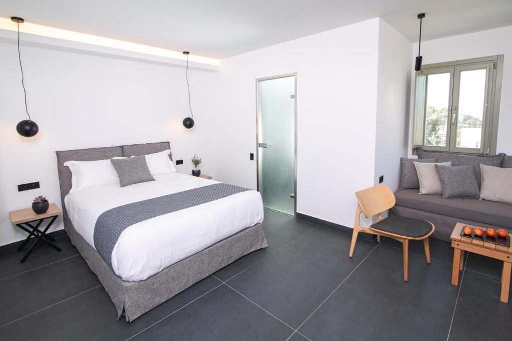 Łóżko lub łóżka w pokoju w obiekcie Kallos Imar Boutique Hotel