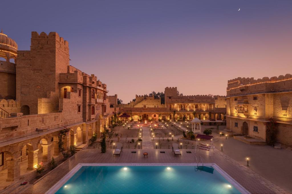 a view of a courtyard with a pool in a building at WelcomHeritage Mohangarh Fort in Jaisalmer
