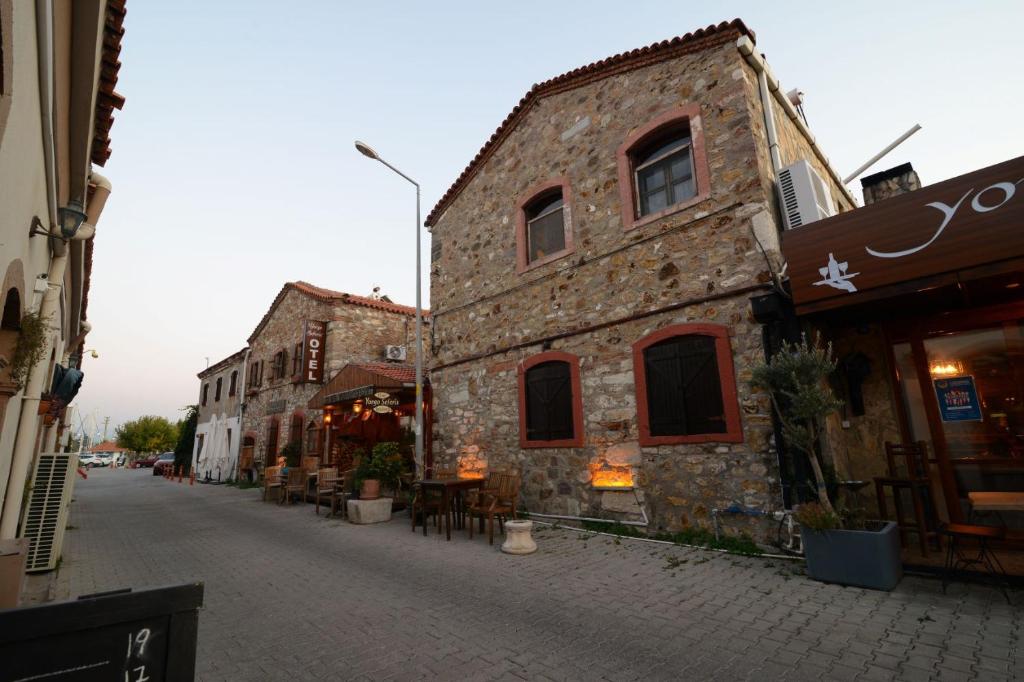 an old stone building on a city street at Otel Yorgo Seferis in Urla