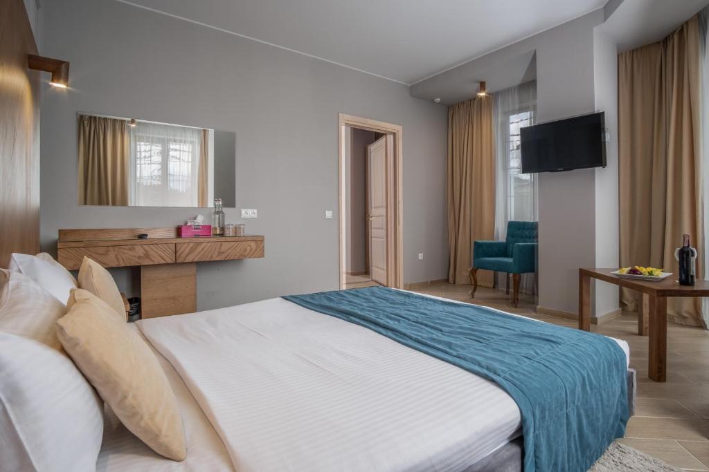 Postel nebo postele na pokoji v ubytování Boomerang Boutique Hotel