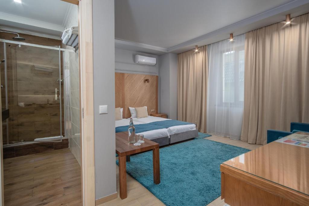 Postel nebo postele na pokoji v ubytování Boomerang Boutique Hotel