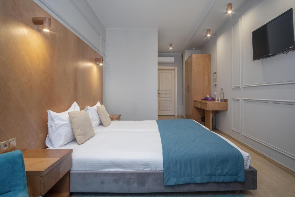Postel nebo postele na pokoji v ubytování Boomerang Boutique Hotel
