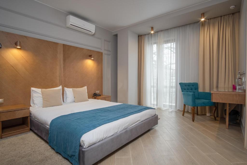 Postel nebo postele na pokoji v ubytování Boomerang Boutique Hotel