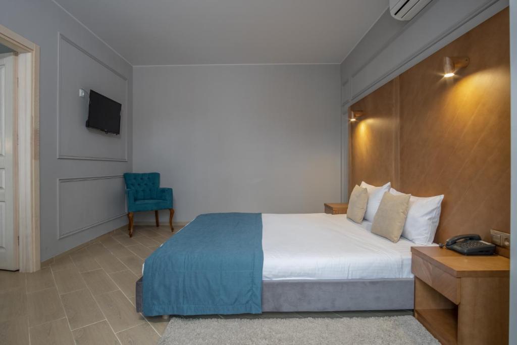 Postel nebo postele na pokoji v ubytování Boomerang Boutique Hotel