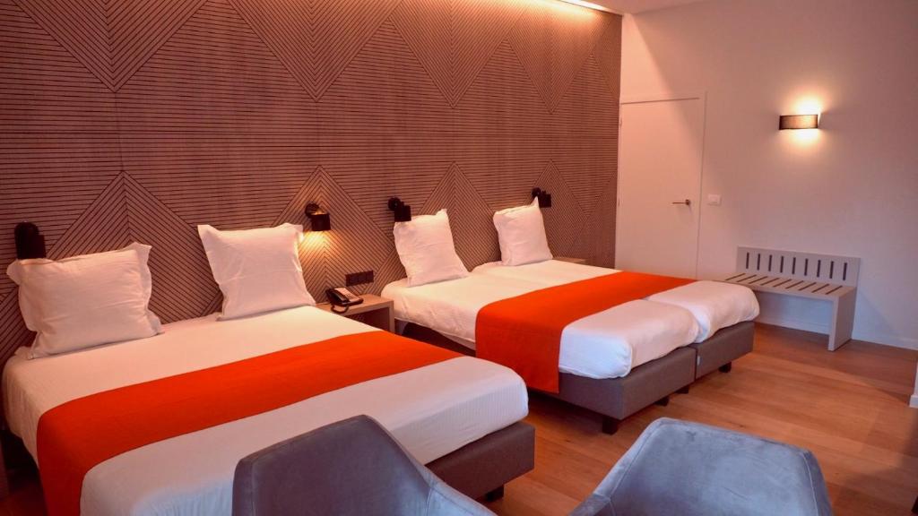 Postel nebo postele na pokoji v ubytování Flanders Hotel