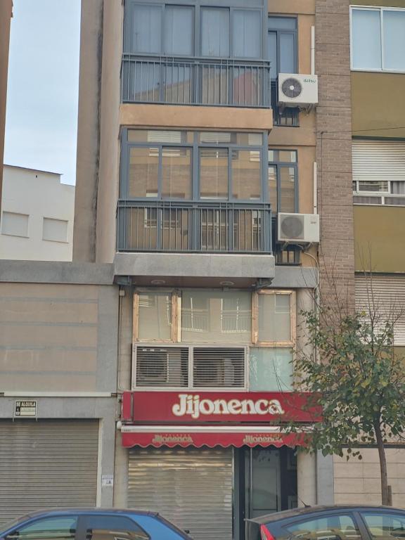 a building with a jumeico sign on the side of it at Apartamento Maravillas in Caravaca de la Cruz