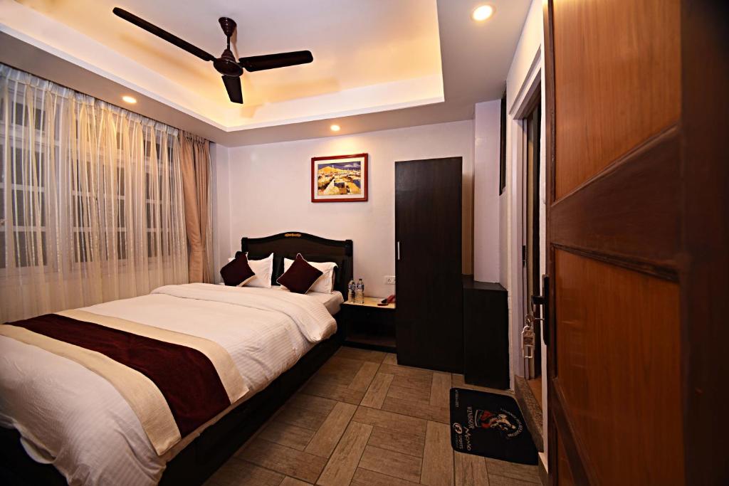 Cama o camas de una habitación en Greatwall International Hotel