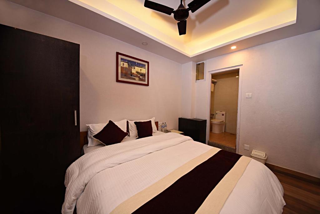 Cama o camas de una habitación en Greatwall International Hotel