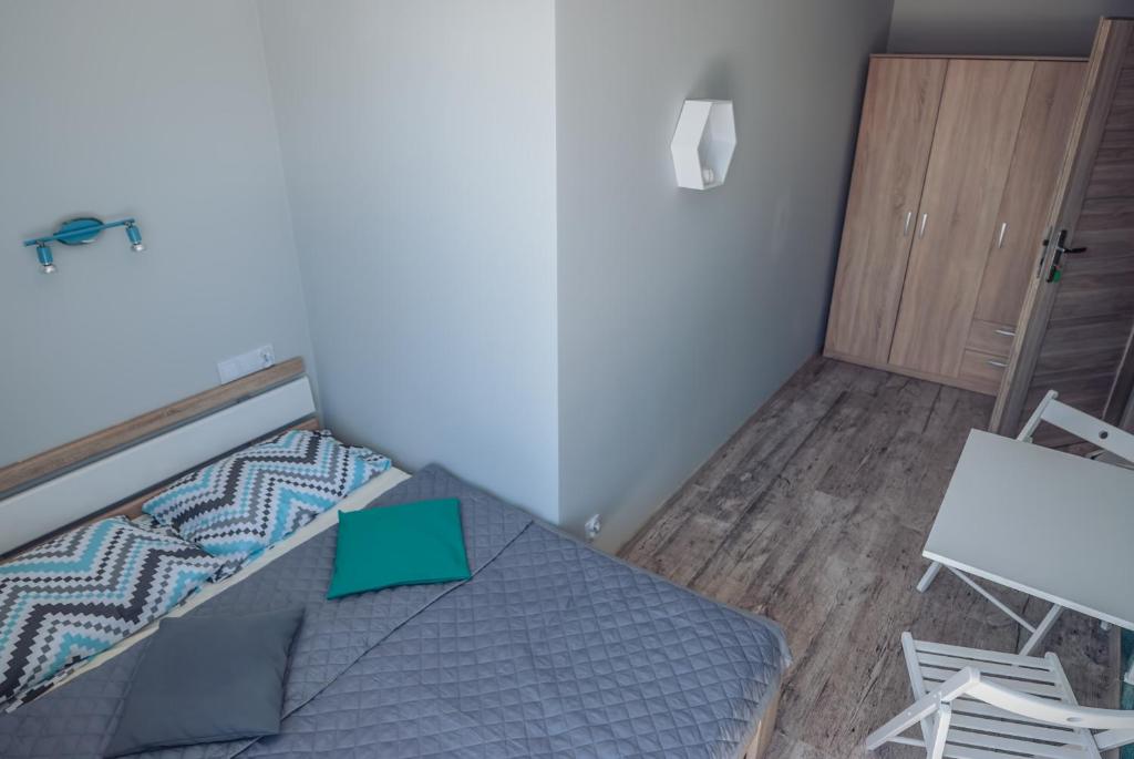 Postel nebo postele na pokoji v ubytování Na Leniwych Wodach