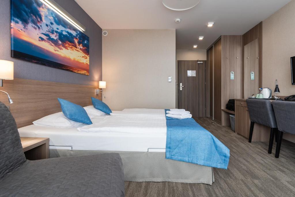 Postel nebo postele na pokoji v ubytování WIND Hotel