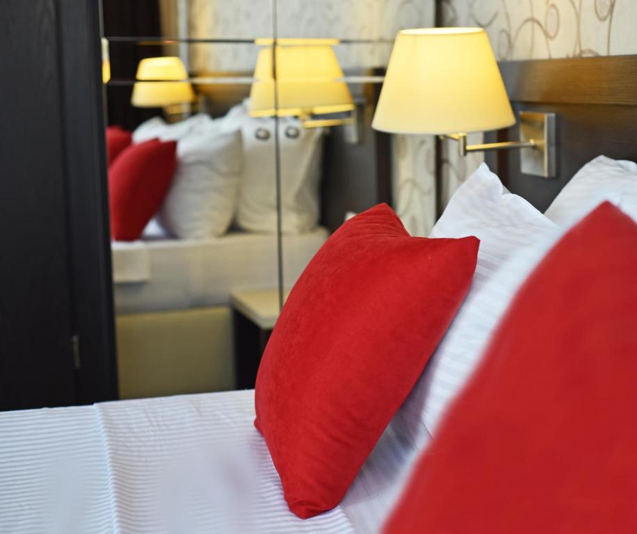 Postel nebo postele na pokoji v ubytování East Gate Boutique Hotel