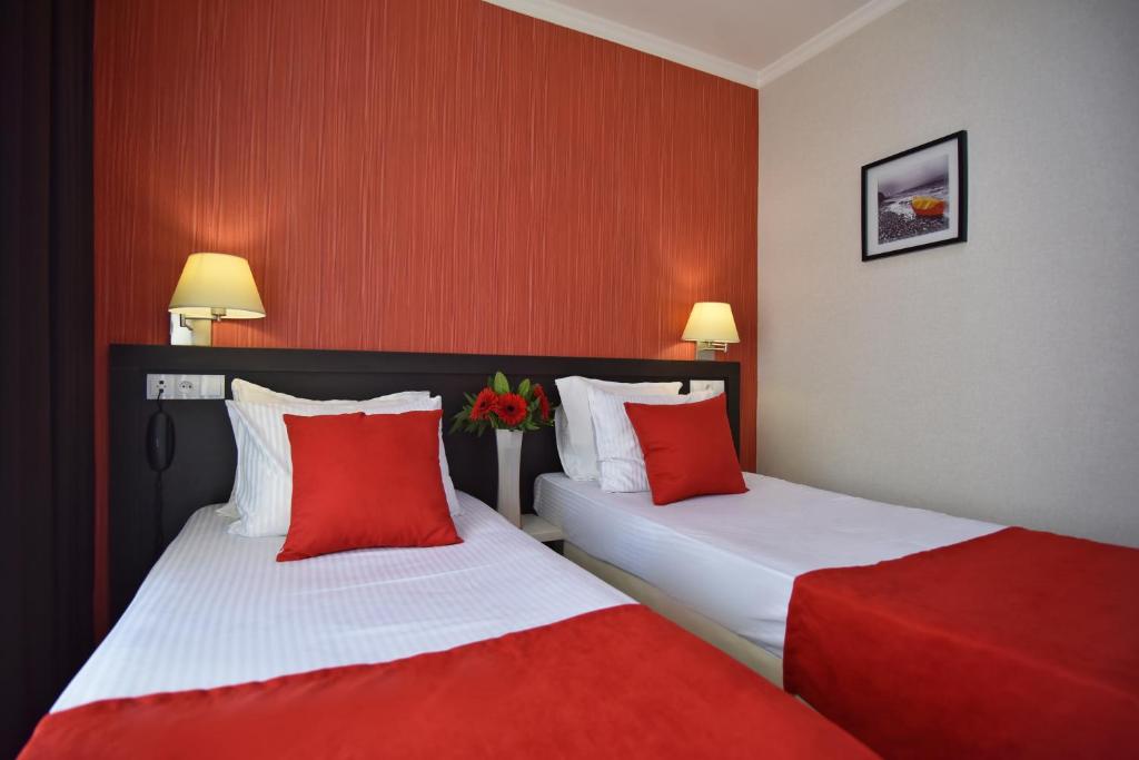 Postel nebo postele na pokoji v ubytování East Gate Boutique Hotel