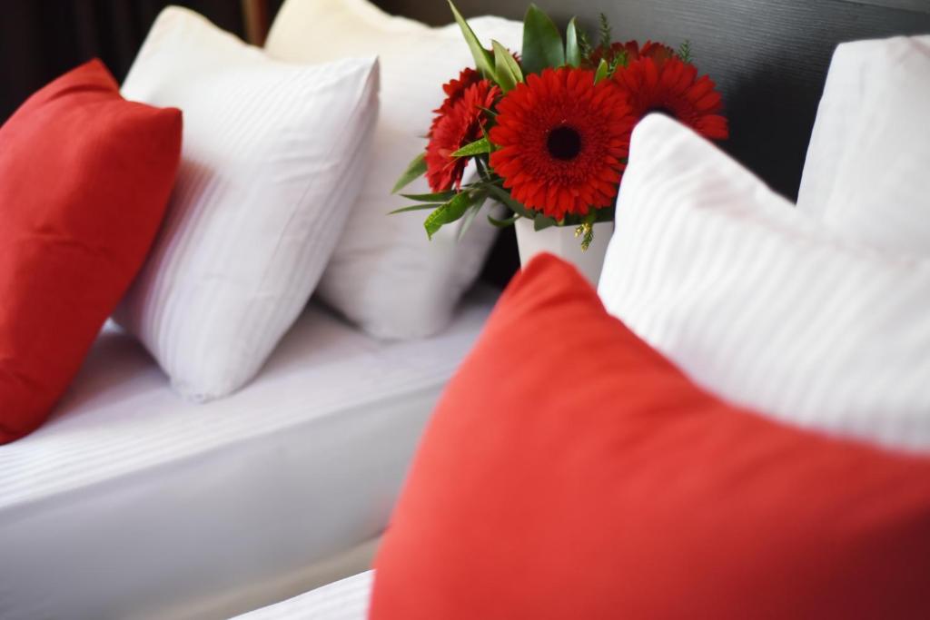 Postel nebo postele na pokoji v ubytování East Gate Boutique Hotel