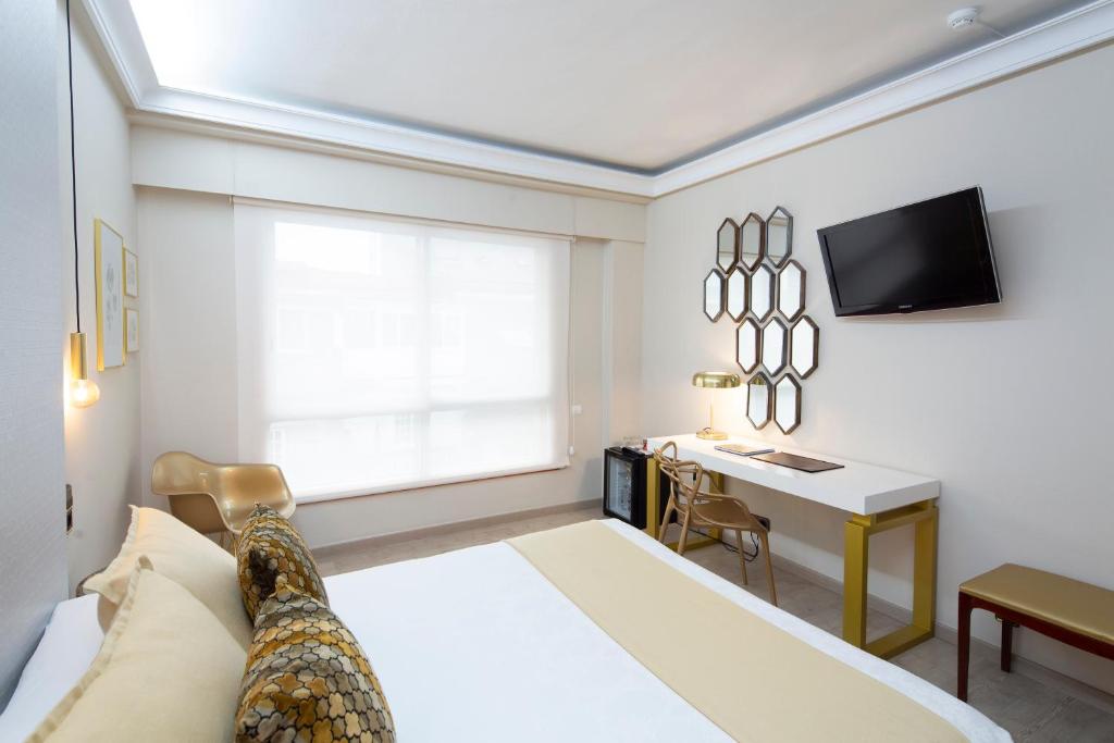 Postel nebo postele na pokoji v ubytování Hotel Ciudad de Vigo
