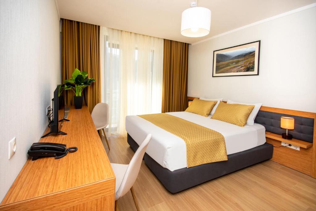 Letto o letti in una camera di Orbi Palace Hotel Official
