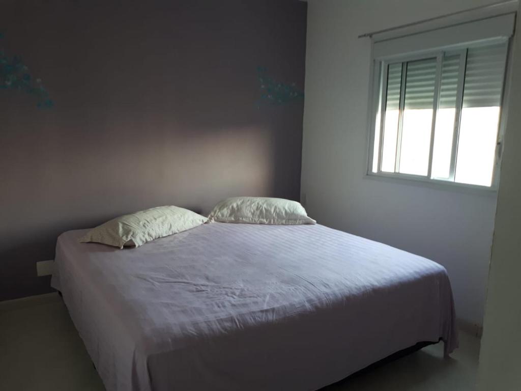 Katil atau katil-katil dalam bilik di Apartamento Lazer Orquídeas