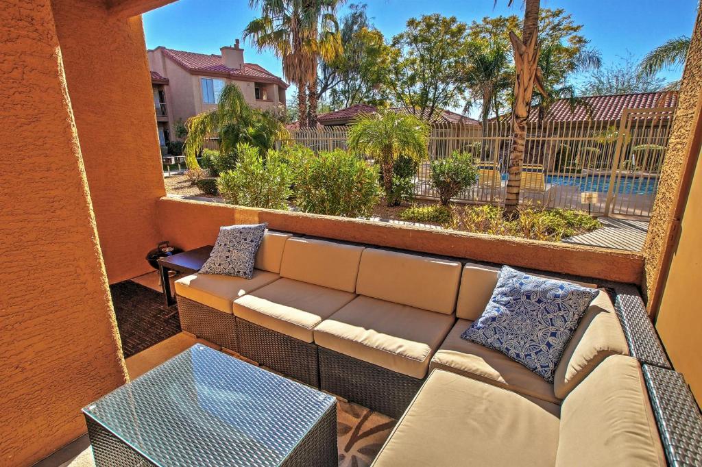 a balcony with a couch and a table at Condo with Pool Access Less Than 4 Mi to Bellair Golf Club! in Phoenix