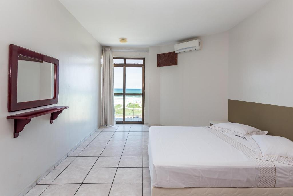 Postel nebo postele na pokoji v ubytování Apart Hotel Porto Príncipe