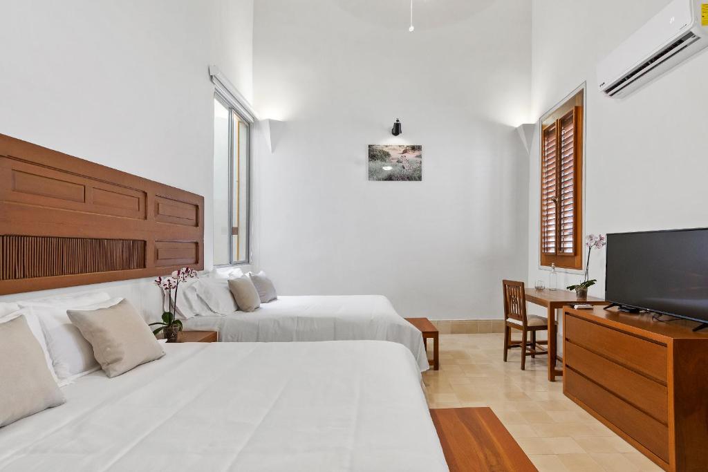 TV a/nebo společenská místnost v ubytování Villa Orquídea Boutique Hotel