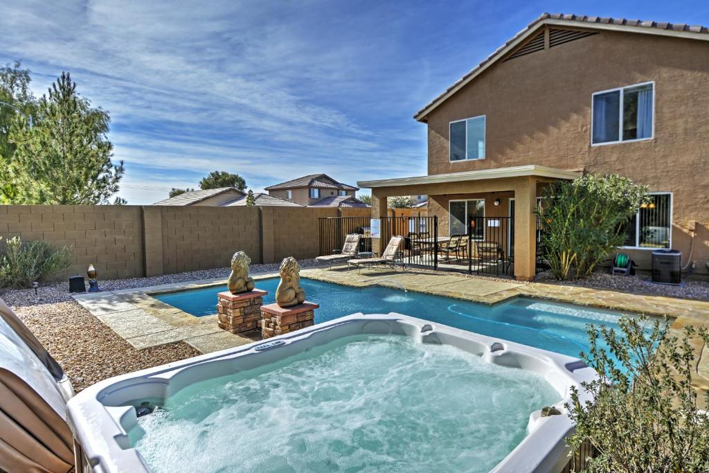 a pool in the backyard of a house at Coolidge Getaway with Pool, Hot Tub and Fire Pit! in Coolidge