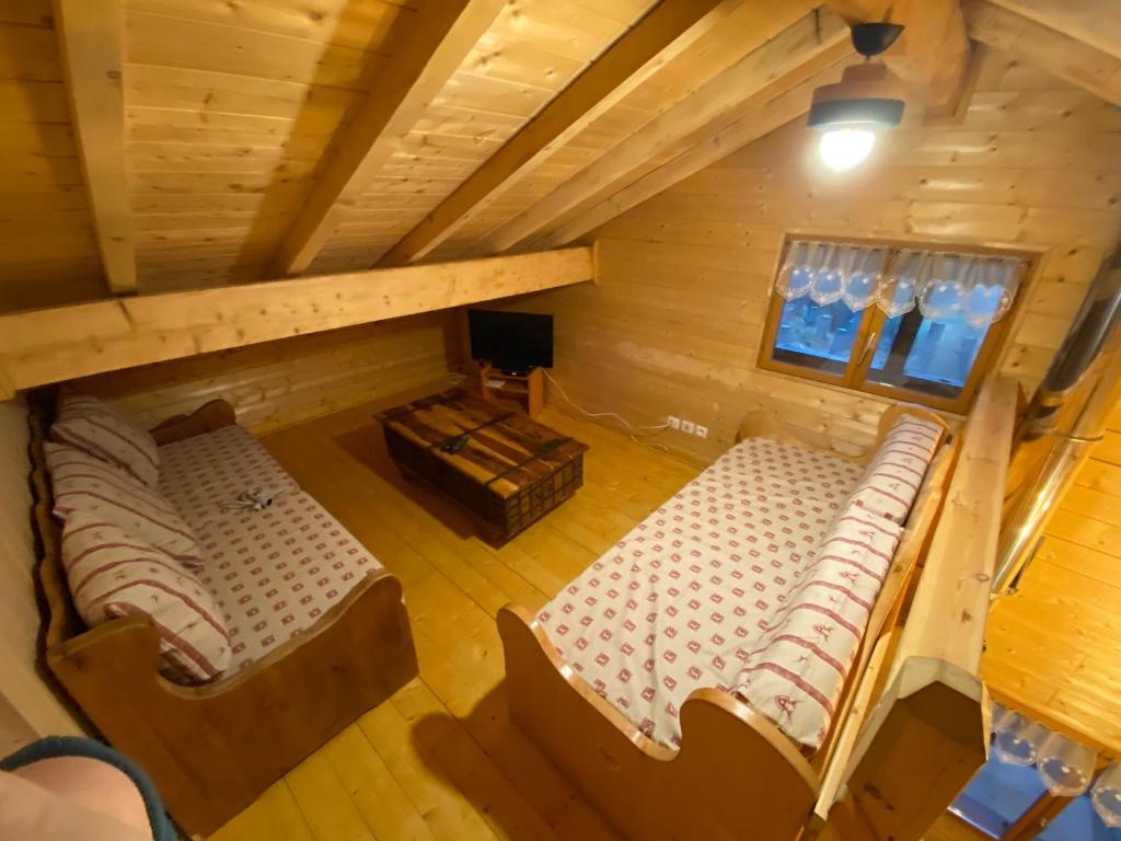 an overhead view of a room in a log cabin at le refuge des Marmottes in Saint-Laurent-du-Jura
