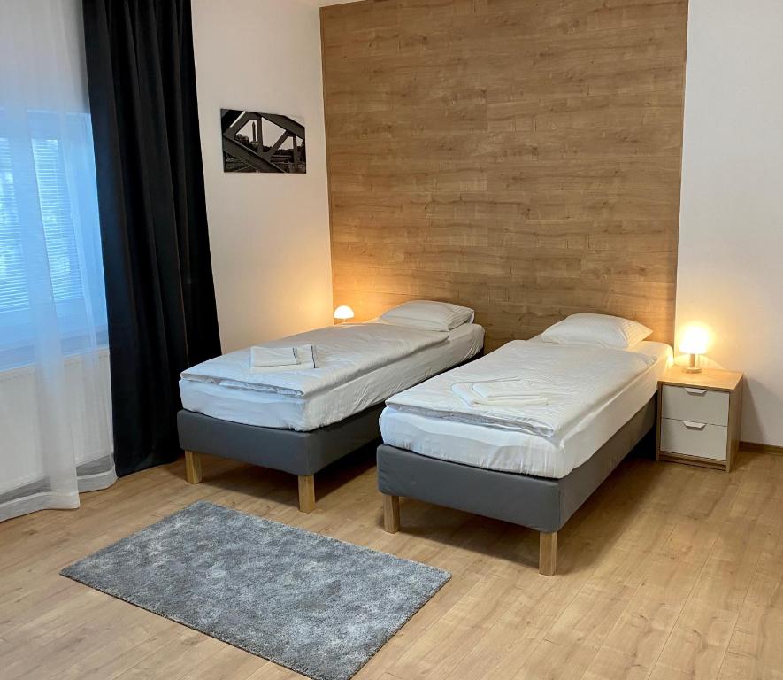 Postel nebo postele na pokoji v ubytování Frýdecká Apartments
