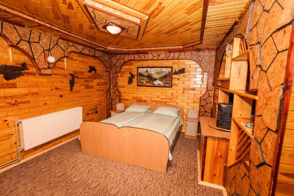 Postel nebo postele na pokoji v ubytování Smerekova Hata