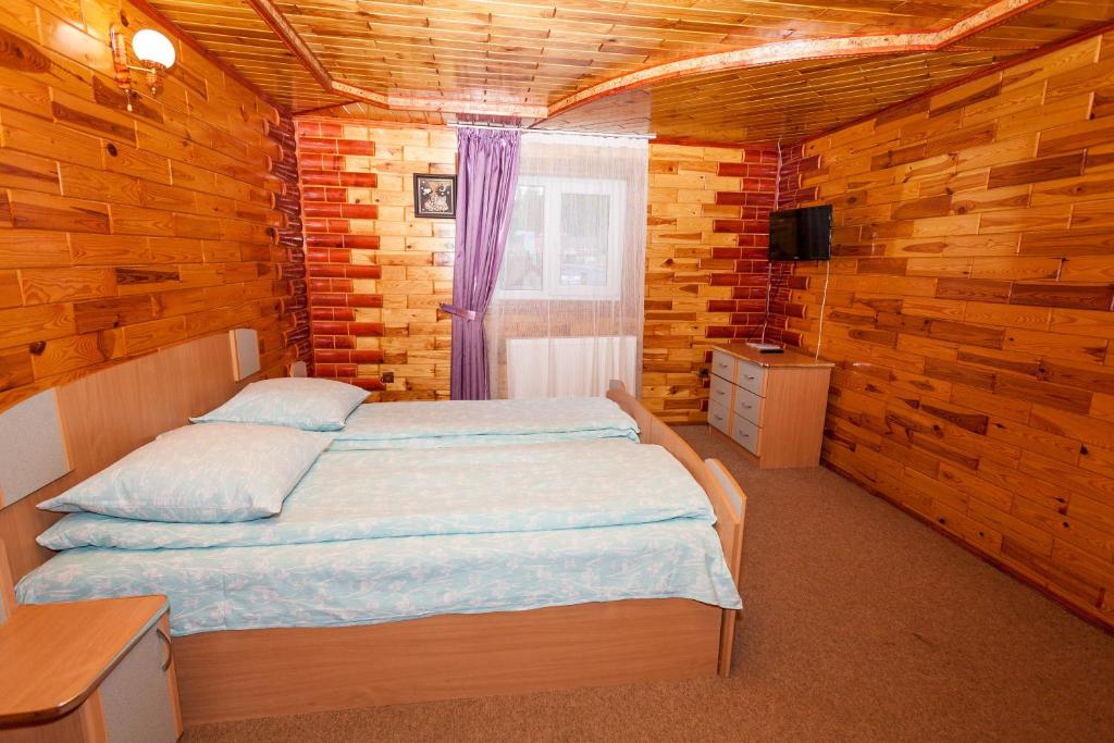 Postel nebo postele na pokoji v ubytování Smerekova Hata