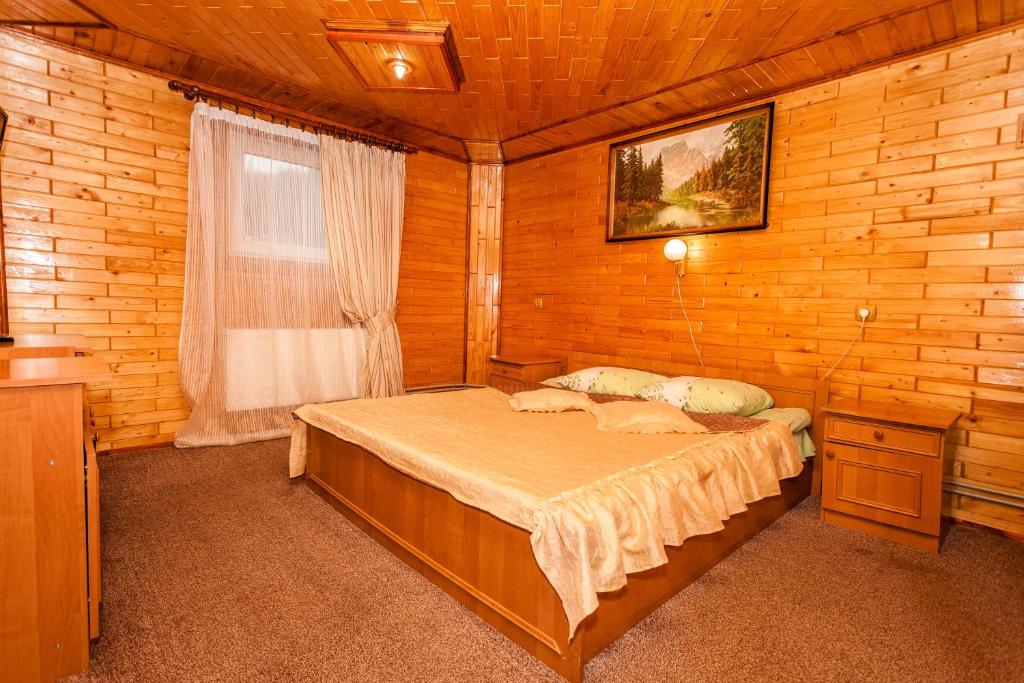 Postel nebo postele na pokoji v ubytování Smerekova Hata