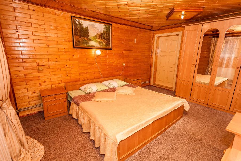 Postel nebo postele na pokoji v ubytování Smerekova Hata