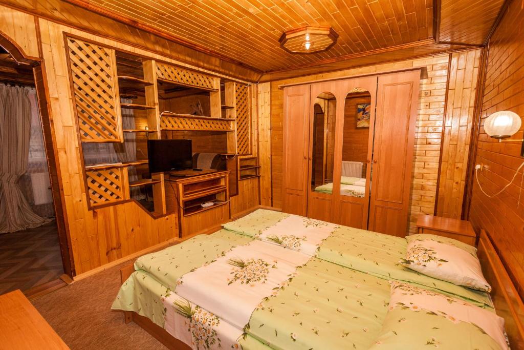 Postel nebo postele na pokoji v ubytování Smerekova Hata
