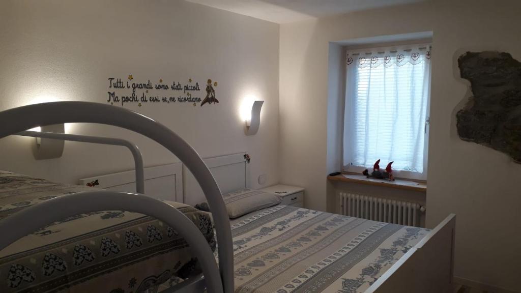 Postel nebo postele na pokoji v ubytování B&B Cuore Trentino