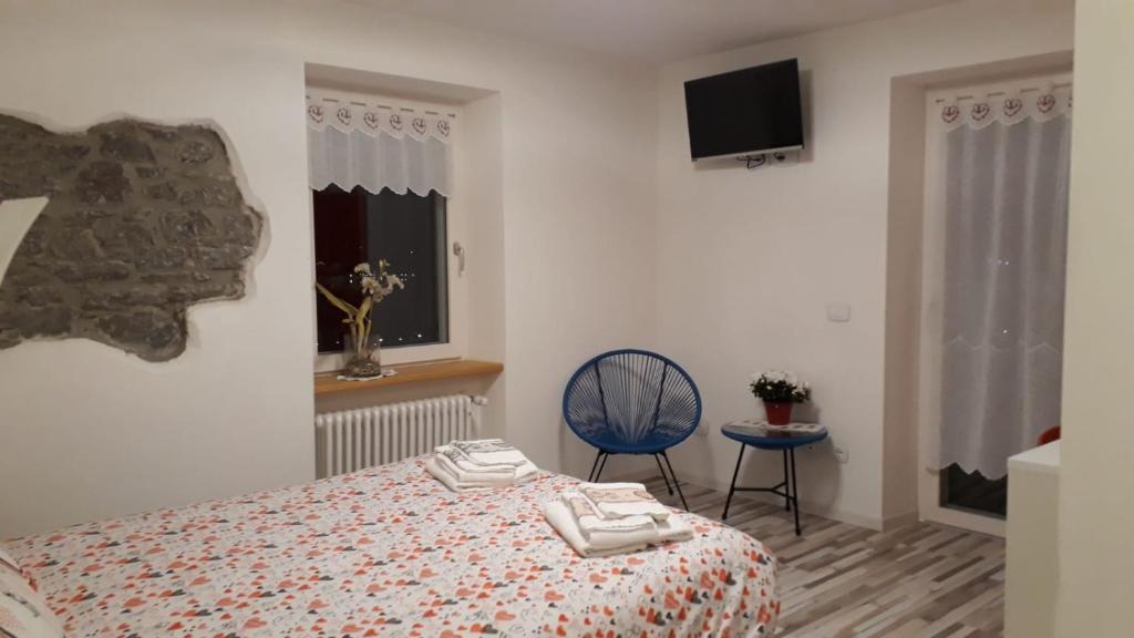 Postel nebo postele na pokoji v ubytování B&B Cuore Trentino